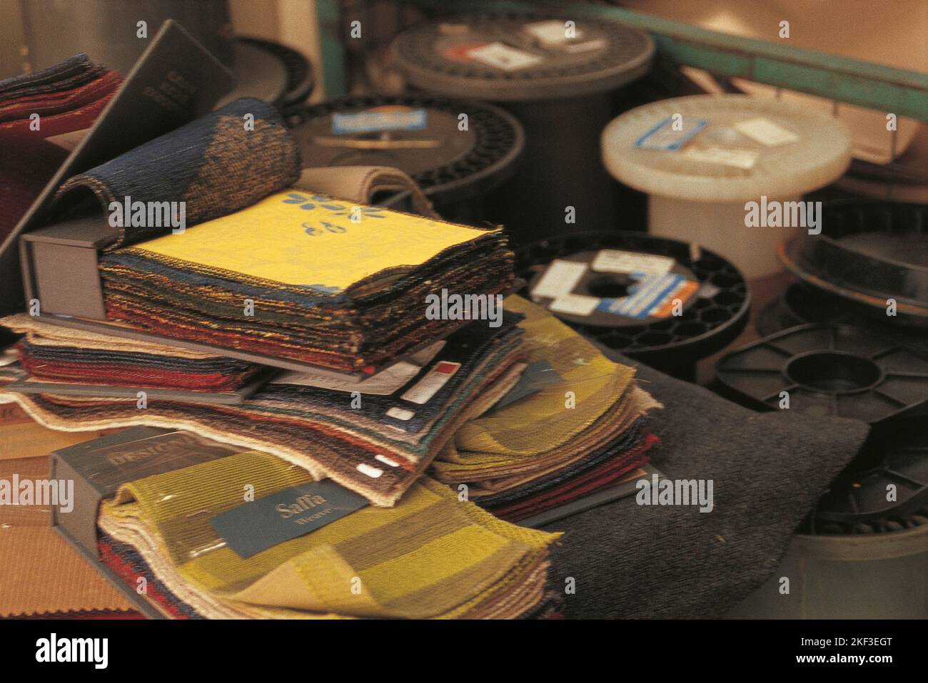 Spools and fabric swatches Stock Photo - Alamy