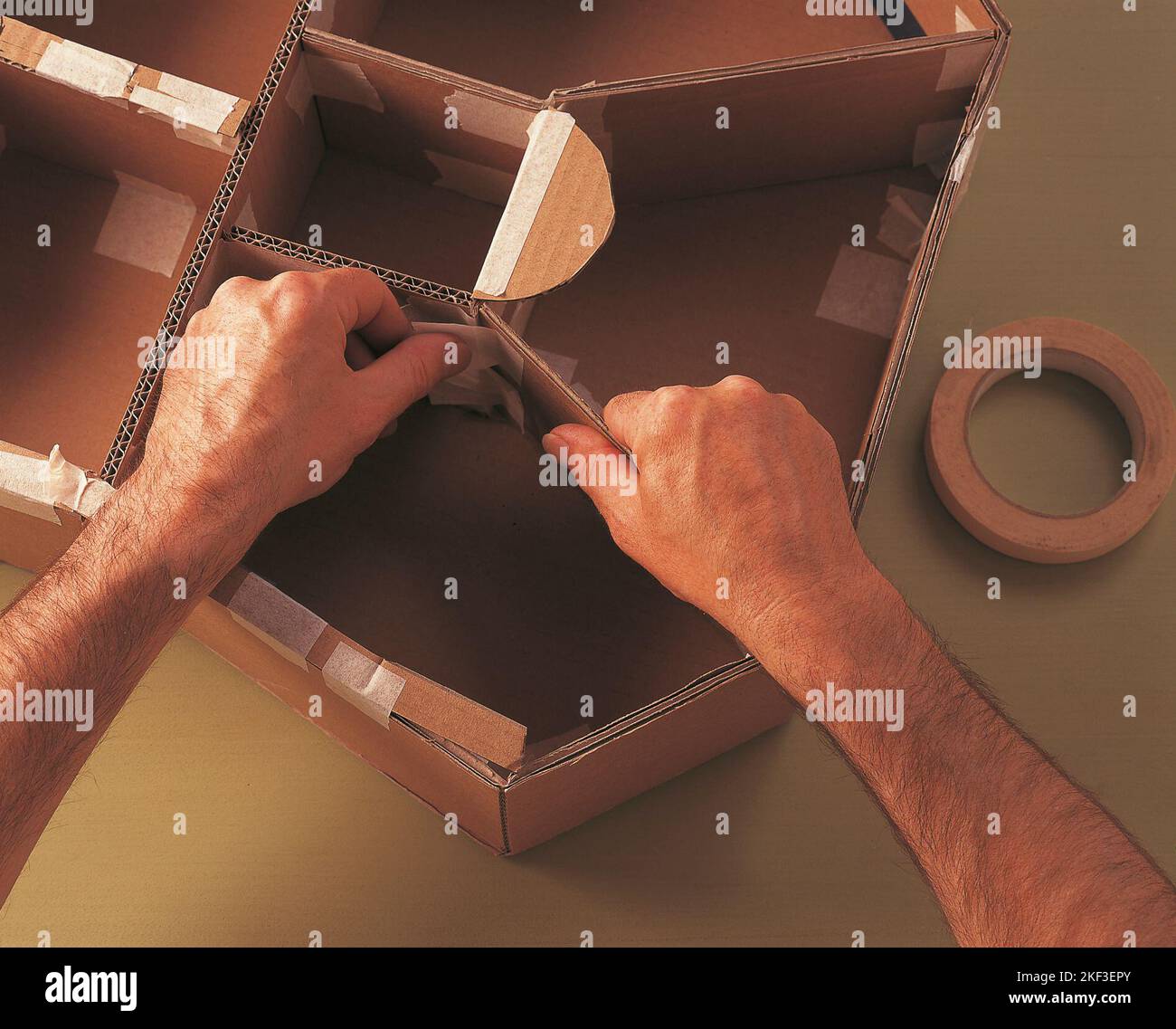 Inserting cardboard section dividers Stock Photo Alamy