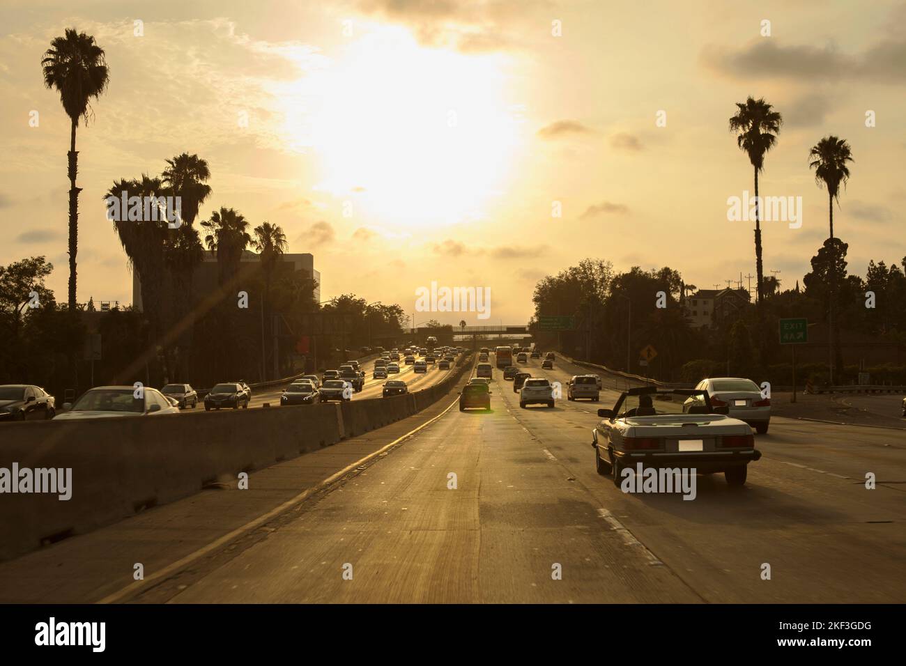 Cars driving on 101 Freeway at sunset in Los Angeles, California Stock