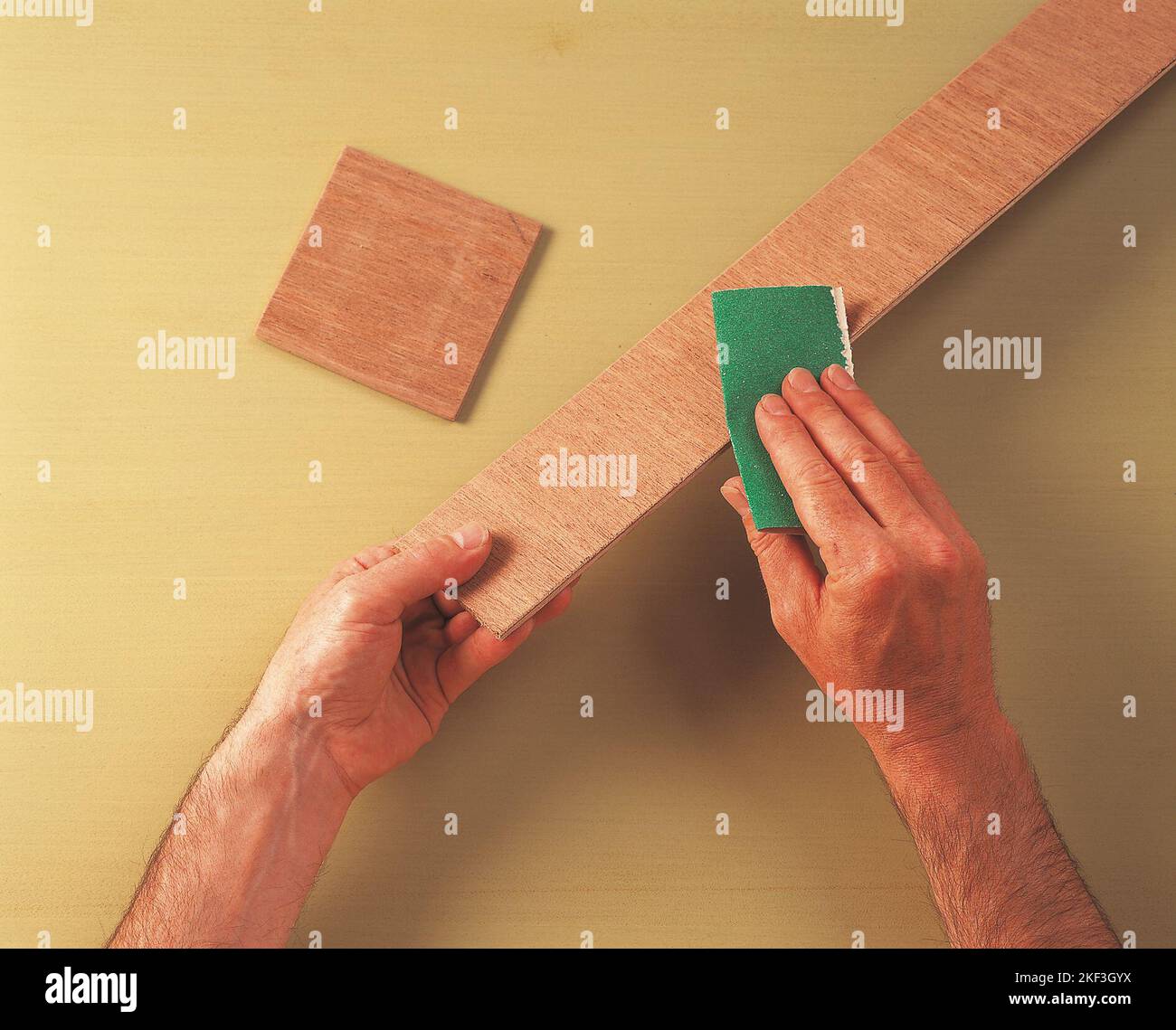 Sanding edges of plywood Stock Photo Alamy