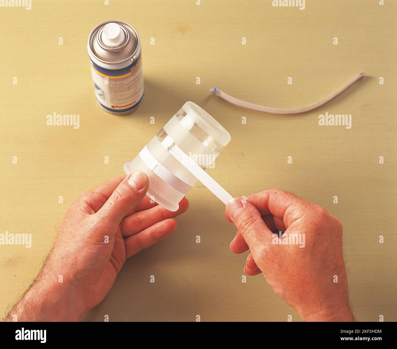 Wrapping a piece of paper around a glass Stock Photo Alamy