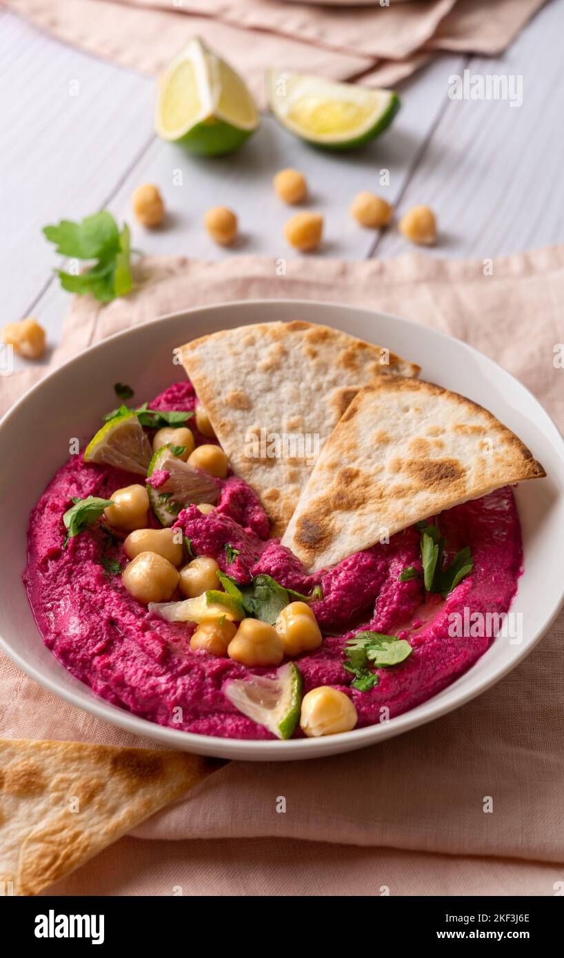Close-up of Beetroot hummus on white table Stock Photo
