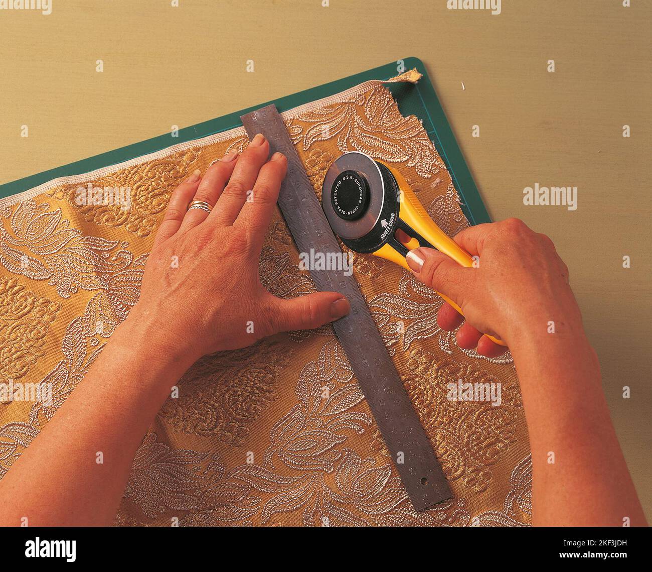 Cutting fabric with a cutting wheel Stock Photo Alamy