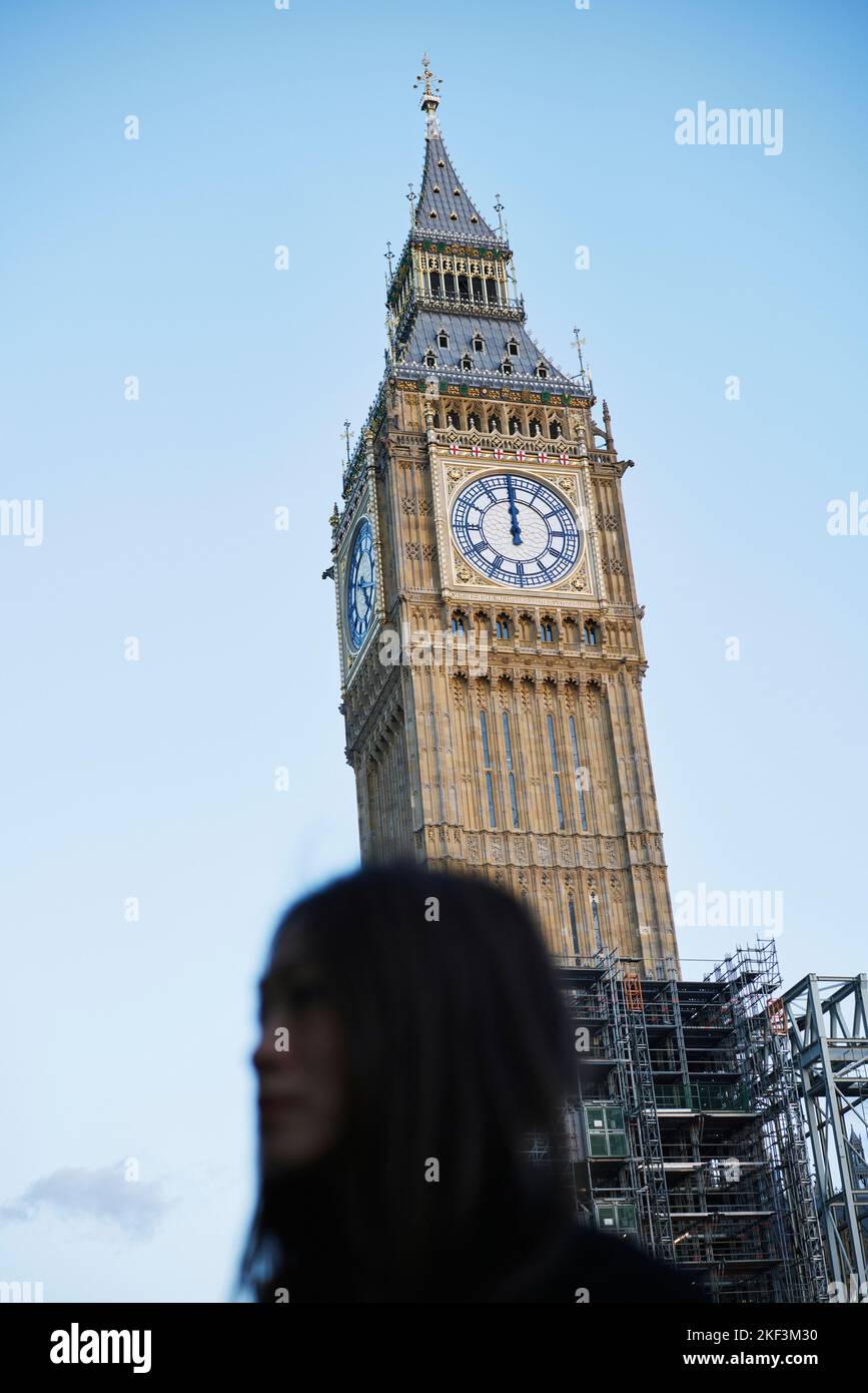 Woman beside Big Ben in London, England Stock Photo