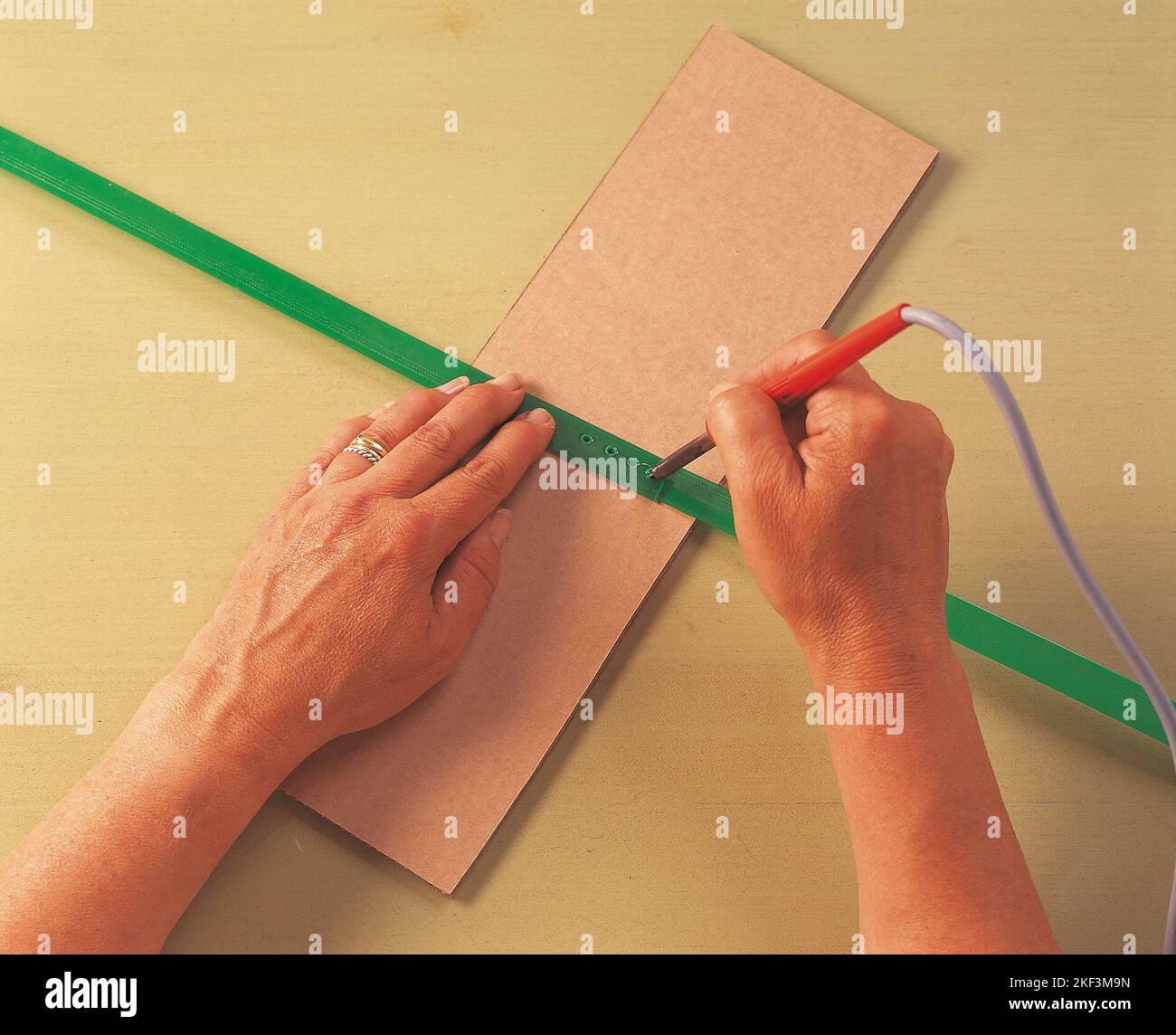 Joining two pieces of plastic by melting them together Stock Photo Alamy