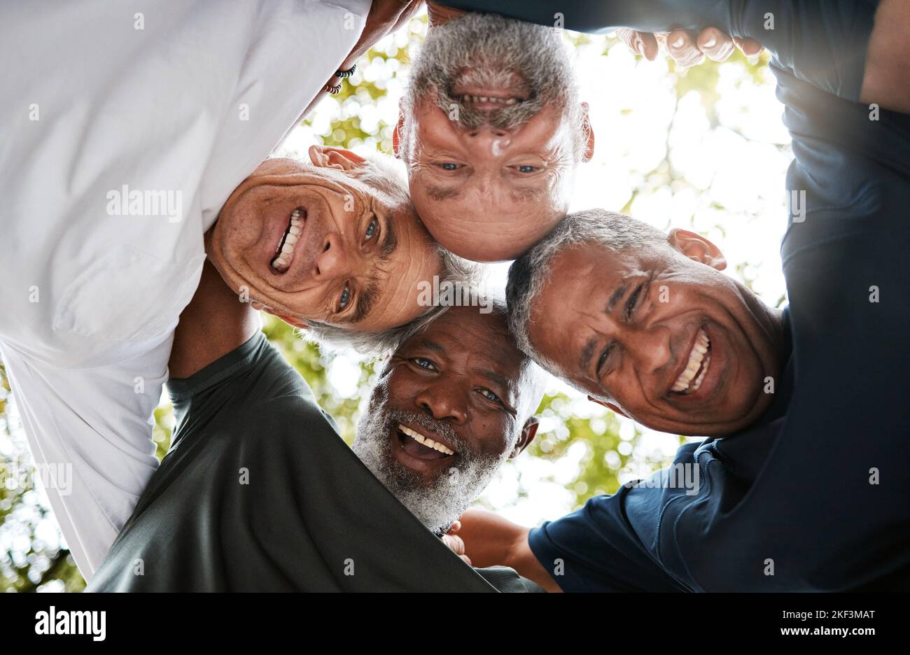 Senior men, friends and community together in a circle for support, trust and diversity with a smile, happiness and collaboration. Portrait, face and Stock Photo