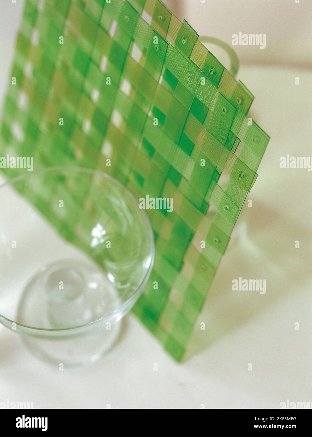 Woven plastic mat positioned between glass containers Stock Photo Alamy