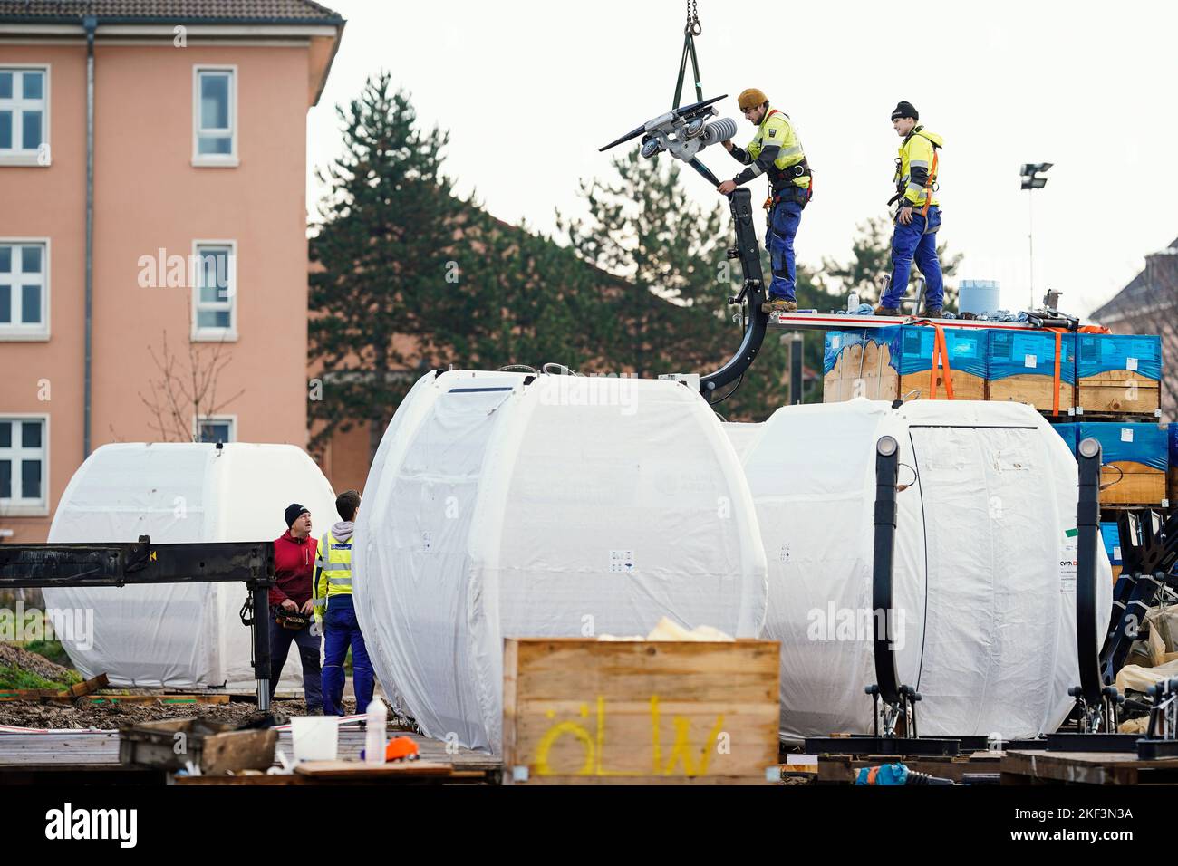 Mannheim, Germany. 16th Nov, 2022. Workers fix cable car cabins on the
