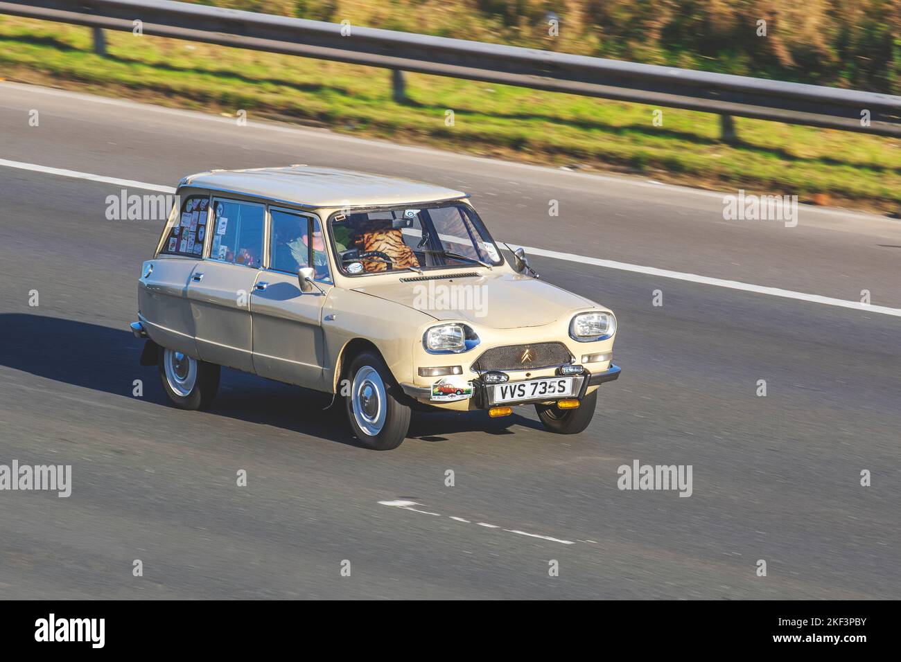 1977 70s seventies, beige CITROEN AMI CHARLSTN 802cc, Classic Citroen 2cv Charleston Estate 4 speed manual; travelling on the M6 motorway UK Stock Photo