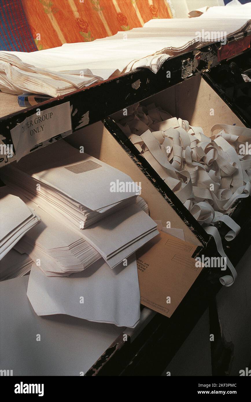 Compartments with different types of office paper stationery Stock