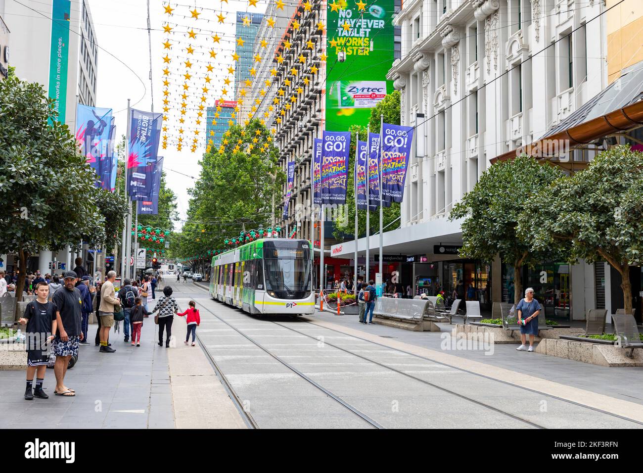 Melbourne tram on Bourke street in the city centre with Christmas lights and Christmas shoppers,Melbourne CBD,Victoria,Australia Stock Photo