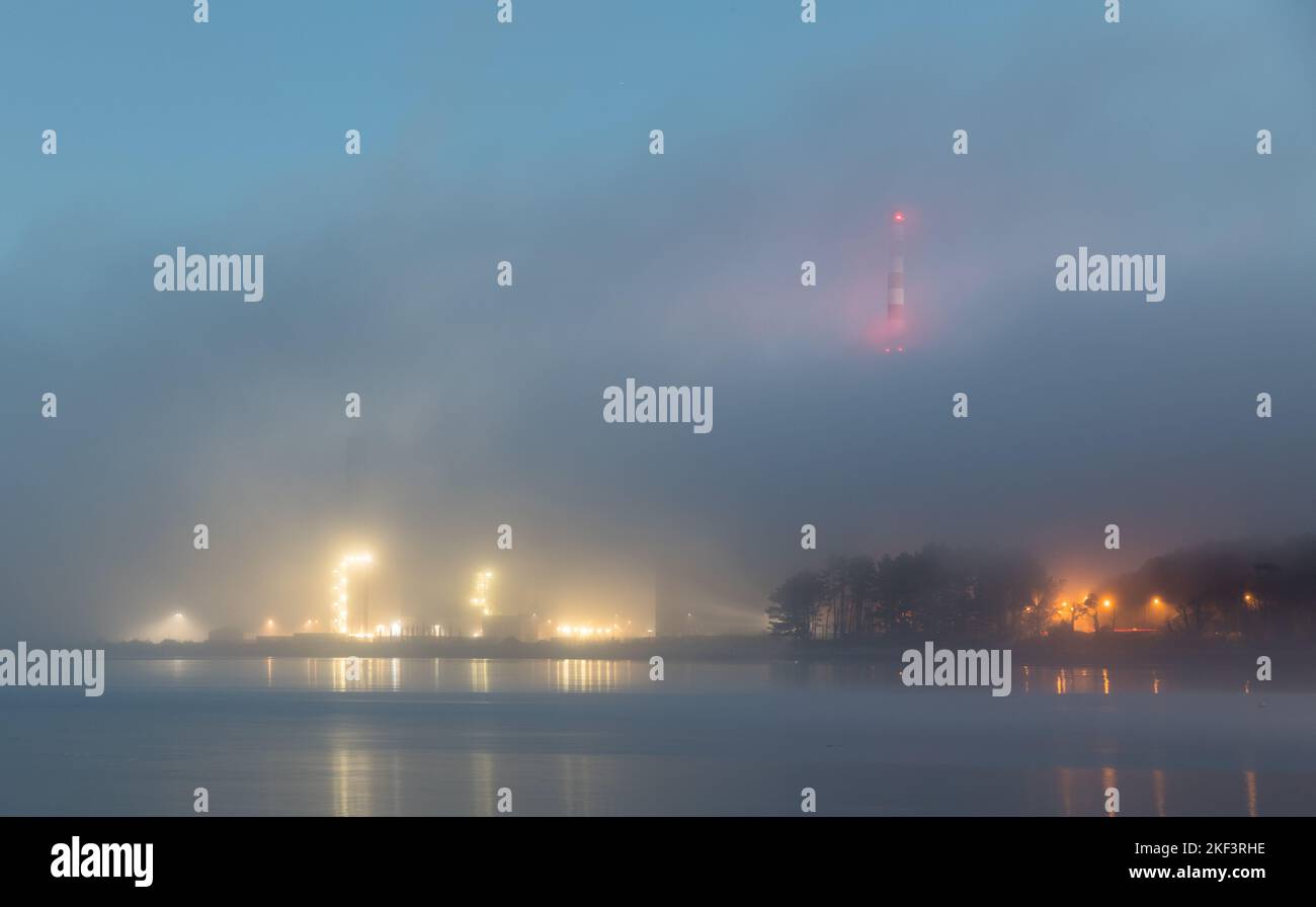 Aghada, Cork, Ireland. 16th November, 2022. Early morning fog shrouds the ESB power station to give an atmospheric view in Aghada, Co. Cork, Ireland. - Credit; David Creedon / Alamy Live News Stock Photo