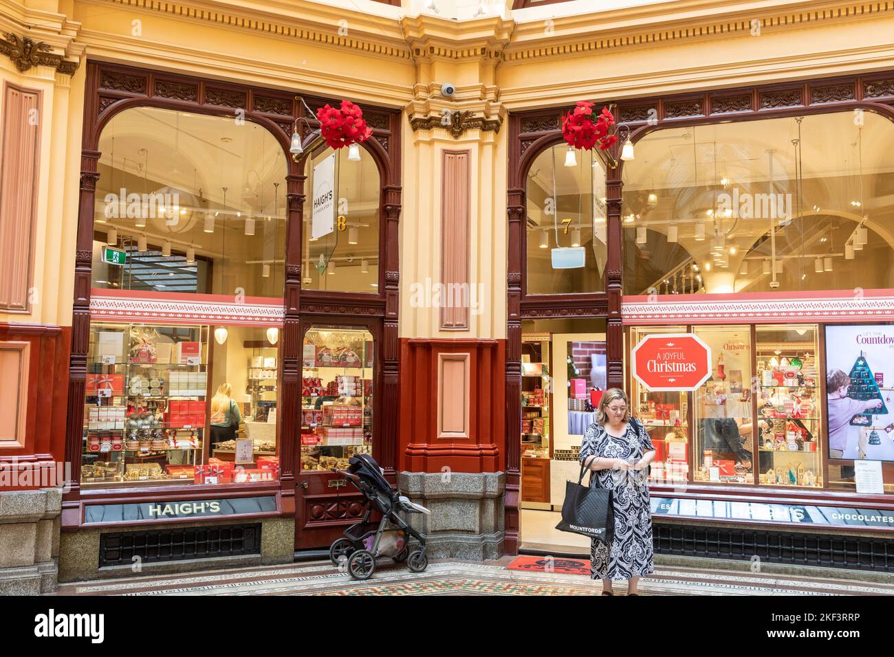 The Block Arcade in Bourke Street Melbourne,woman standing outside Haigh's chocolate shop,Victoria,Australia Stock Photo