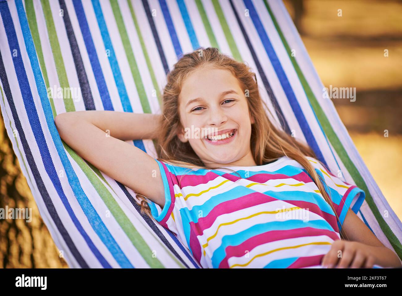 Relaxed summer days. a young girl relaxing in a hammock Stock Photo - Alamy