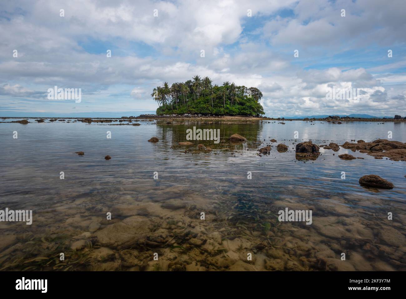 Scene of beautiful small island and clear sea during low tide at Koh Pling , Phuket, Thailand. Stock Photo