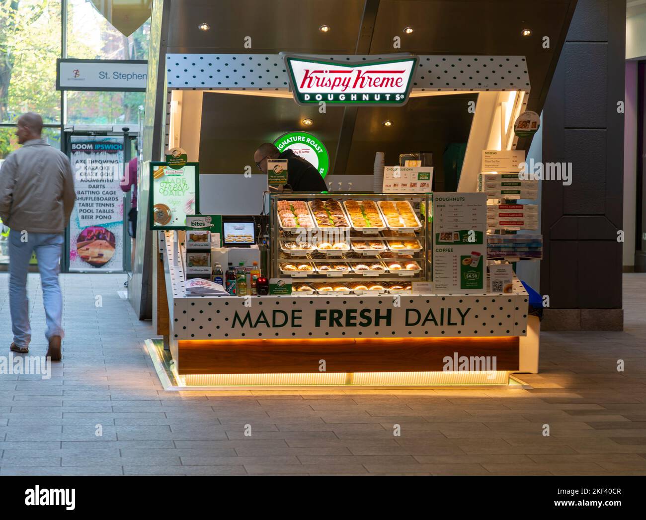 Krispy Kreme doughnuts stall in Buttermarket shopping centre, Ipswich, Suffolk, England, UK Stock Photo