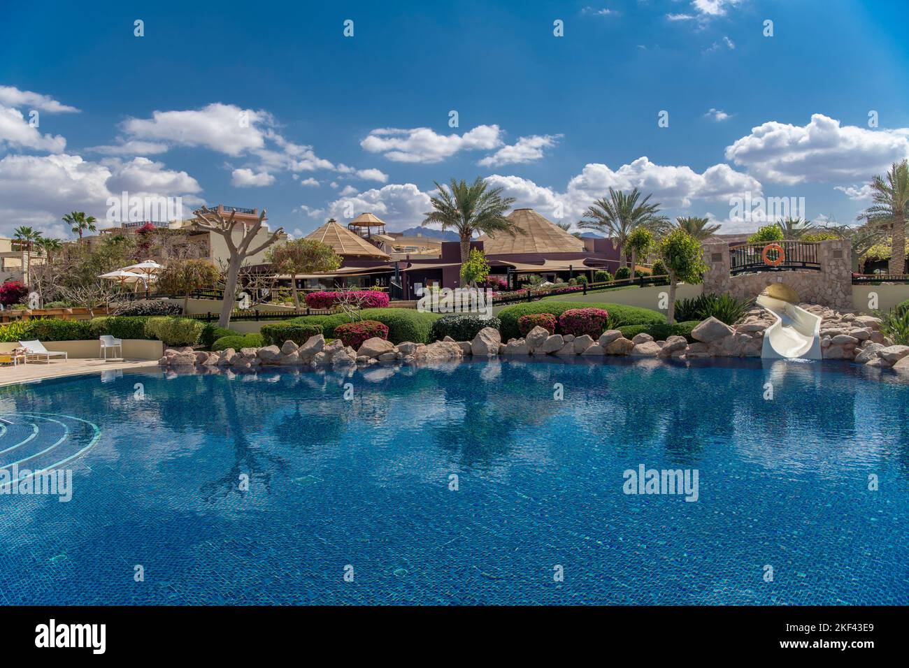Swimming pool with slide Movenpick Tala Bay Aqaba Jordan Stock Photo
