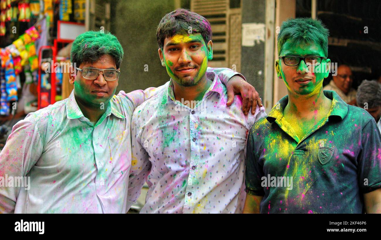 Delhi, India - Indian People face smeared with colors participate in Ganesh Visarjan Stock Photo