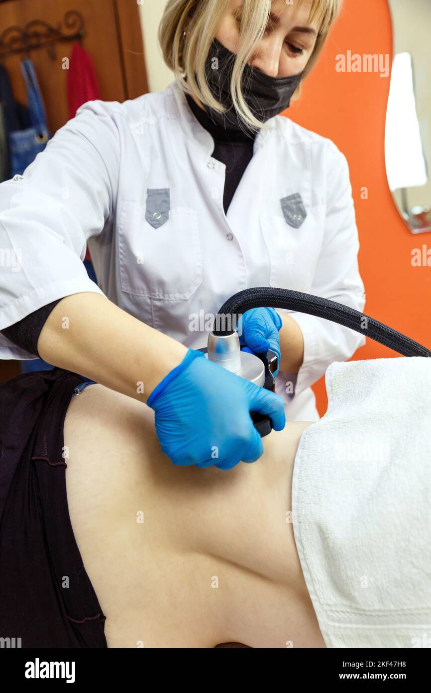 Cavitation massage to reduce subcutaneous fat in the spa Stock Photo ...