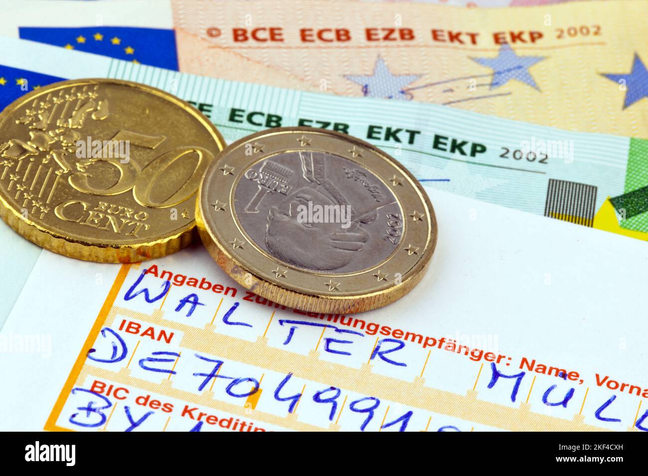 Überweisungsauftrag an eine Bank, Euromünzen und Banknoten, Euro, Stock Photo