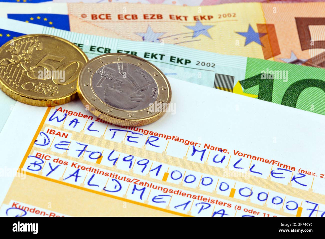 Überweisungsauftrag an eine Bank, Euromünzen und Banknoten, Euro, Stock Photo