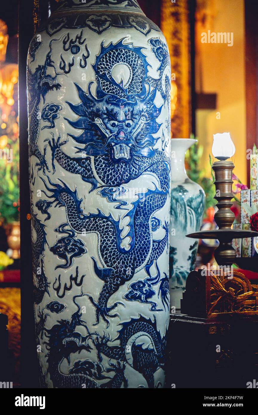A vertical shot of an ancient China glass vase in a Buddhist temple in Vietnam Stock Photo