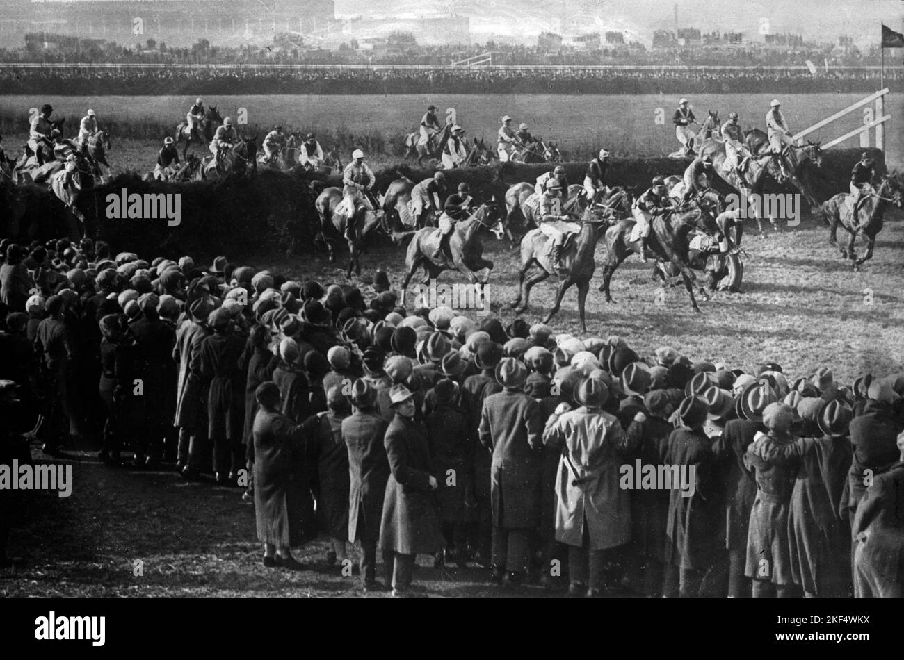 The field taking the first fence, the first time round Stock Photo Alamy