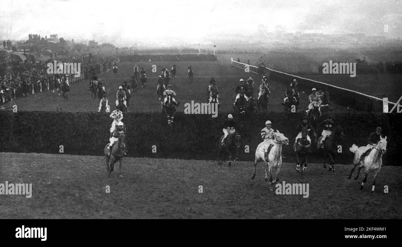 The field taking Becher's Brook the first time round Stock Photo Alamy