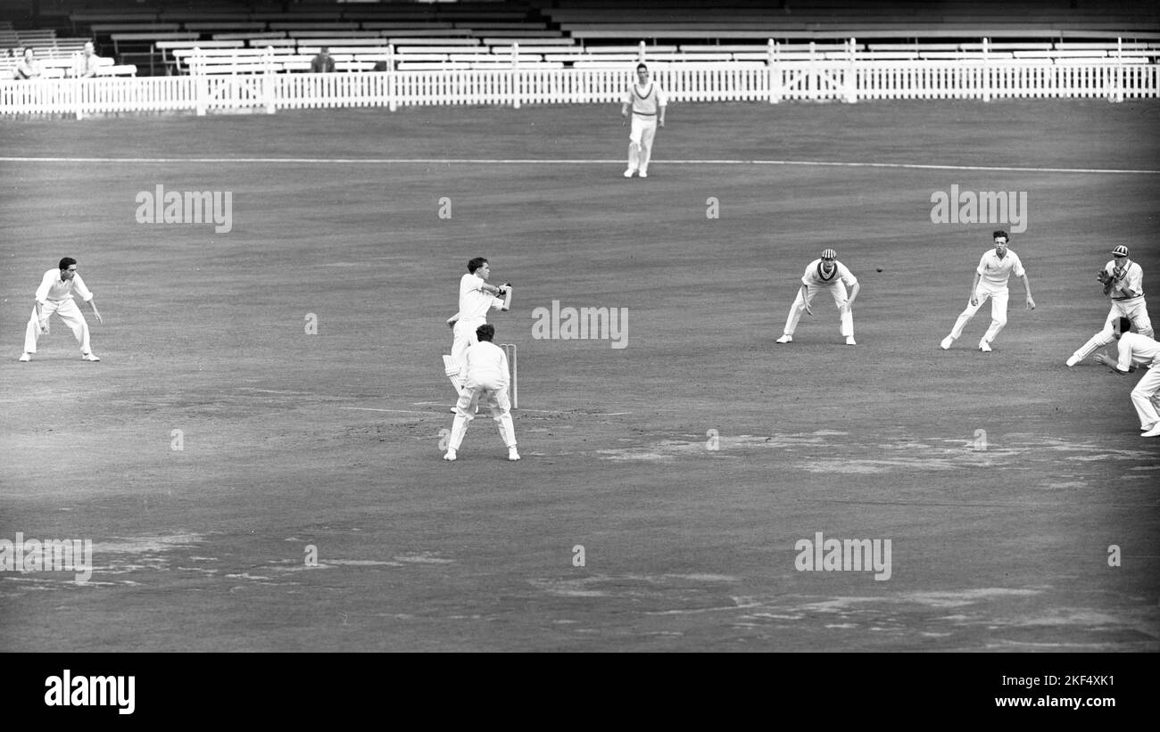 P.J. Kippax (the Rest) drives a ball from R.I. Jefferson, which is