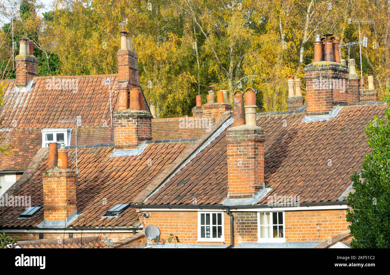 Chimney pots, TV aerials and panelled roofs, Woodbridge, Suffolk, England, UK Stock Photo