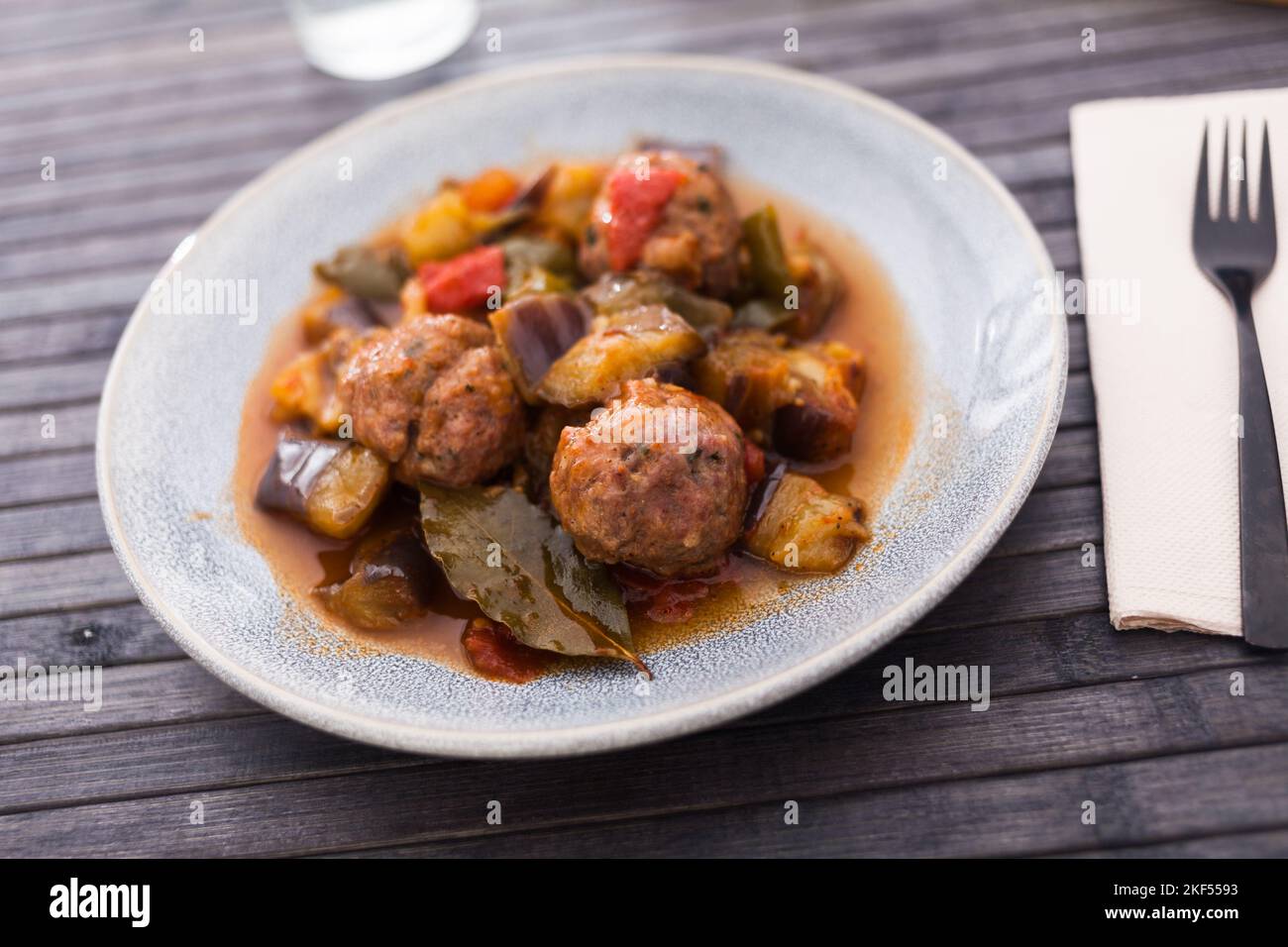 cooked meatballs with stewed eggplant in bowl Stock Photo
