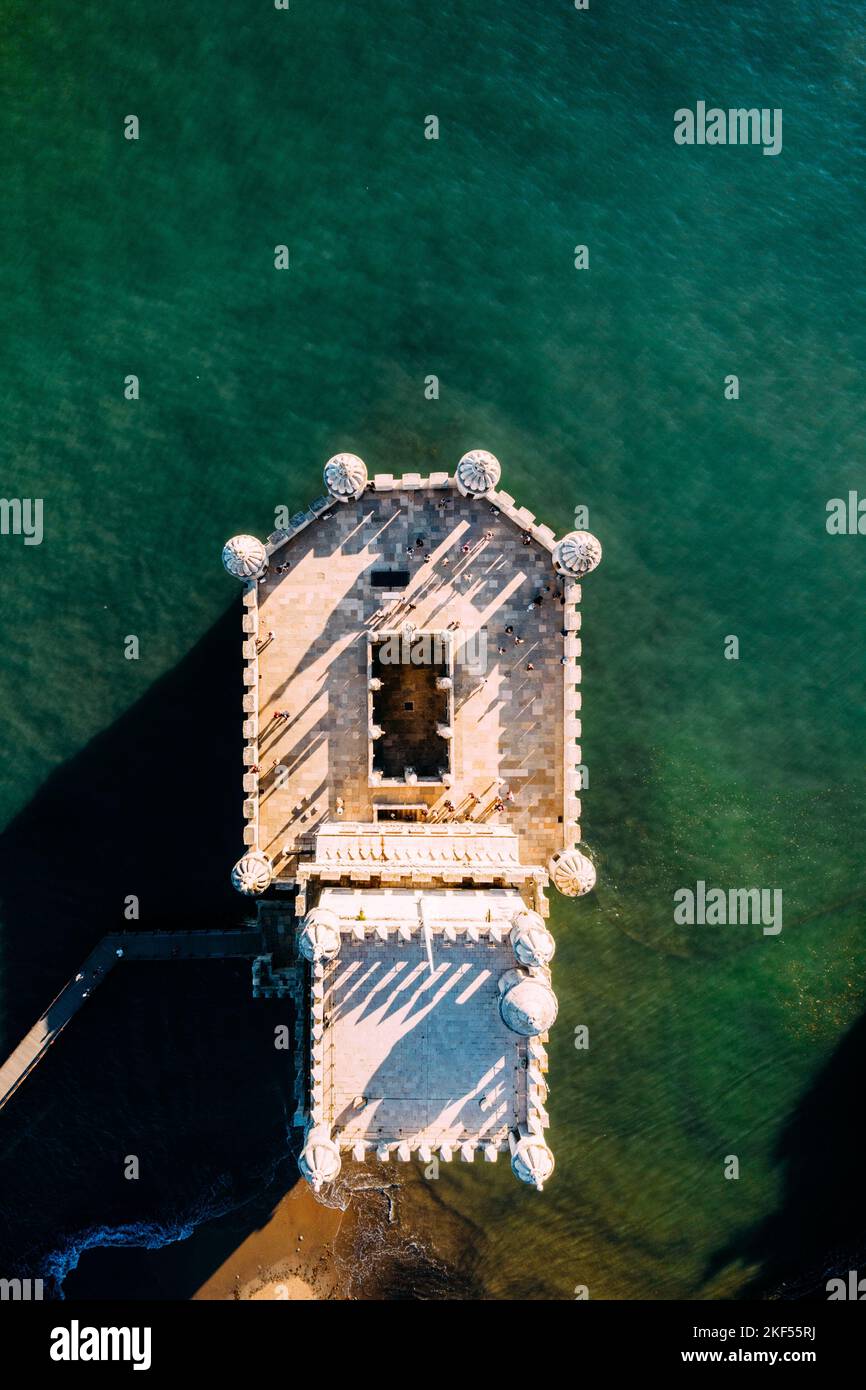 High altitude aerial top down photo of belem Tower in Portuguese Torre de Belem or Tower of St Vincent fortified tower located in Santa Maria de Belem Stock Photo