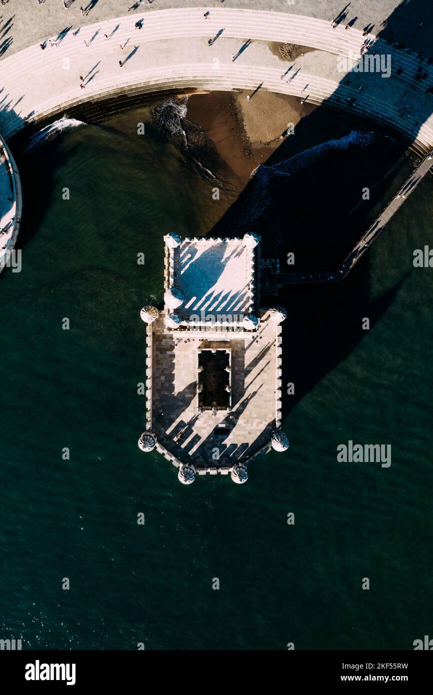 High altitude aerial top down photo of belem Tower in Portuguese Torre de Belem or Tower of St Vincent fortified tower located in Santa Maria de Belem Stock Photo