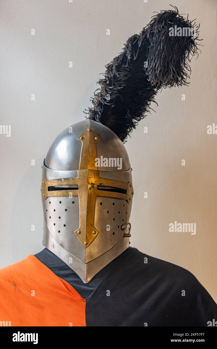 Armor of a medieval knight with a helmet with a feather Stock Photo Alamy