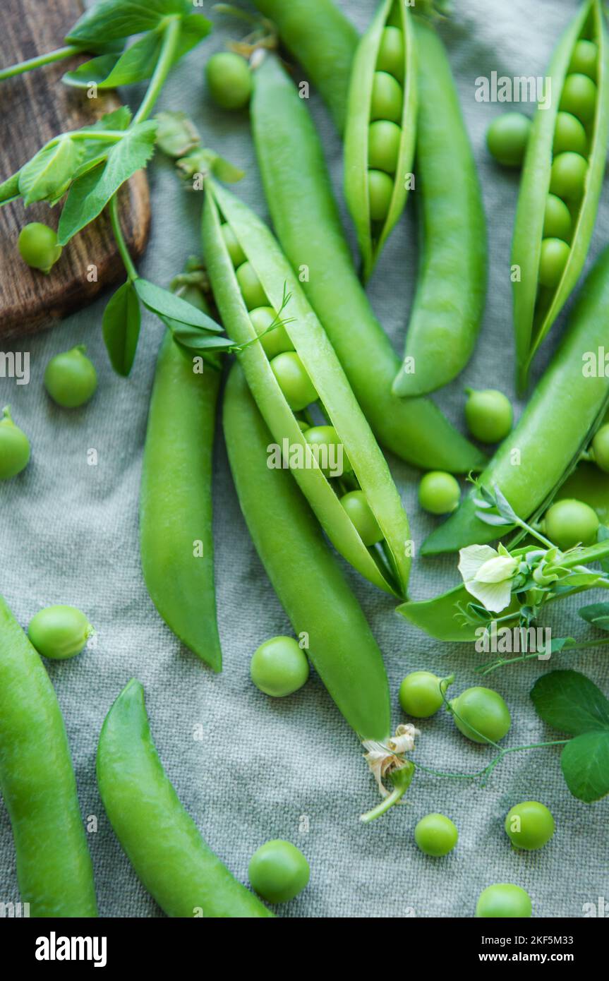 Young fresh juicy pods of green peas. Healthy organic food Stock Photo