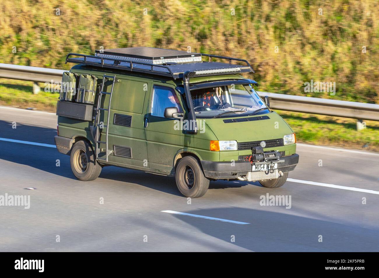 1994 90s nineties, Green Expedition VW Volkswagen Transporter 800KGVBVN 1.9L 1896cc Diesel campervan with snorkel exhaust and exterior storage for Jerry fuel cans. Stock Photo