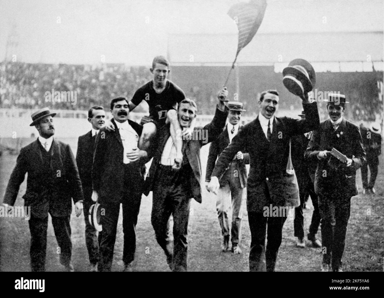 South Africa's Reggie Walker is carried shoulder high by his jubilant