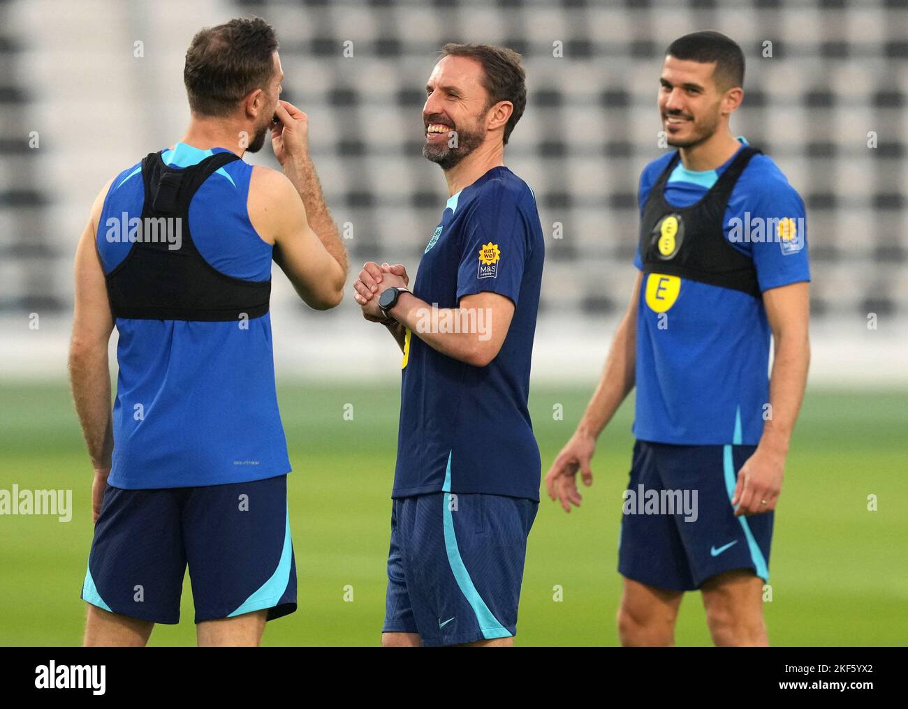 England's Jordan Henderson shares a joke with manager Gareth Southgate and Conor Coady during a training session at the Al Wakrah Sports Club, Stadium Al Wakrah, Qatar.  Picture date: Wednesday November 16, 2022. Stock Photo