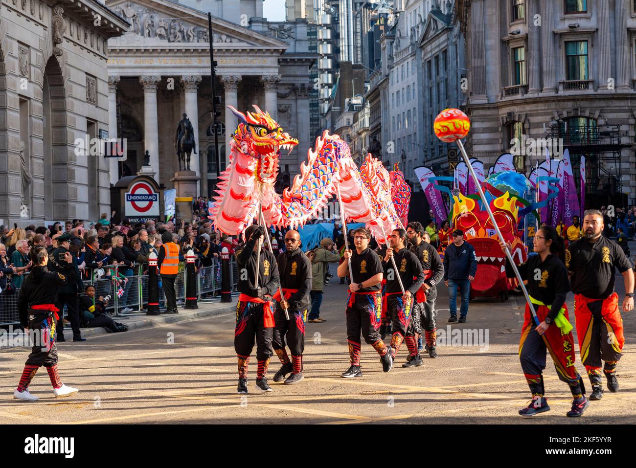 Hong Kong Economic and Trade Office dragon dancers at the Lord Mayor's Show parade in the City of London, UK. Dragon puppet Stock Photo