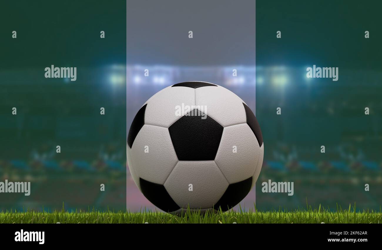 Soccer football ball on a grass pitch in front of stadium lights and