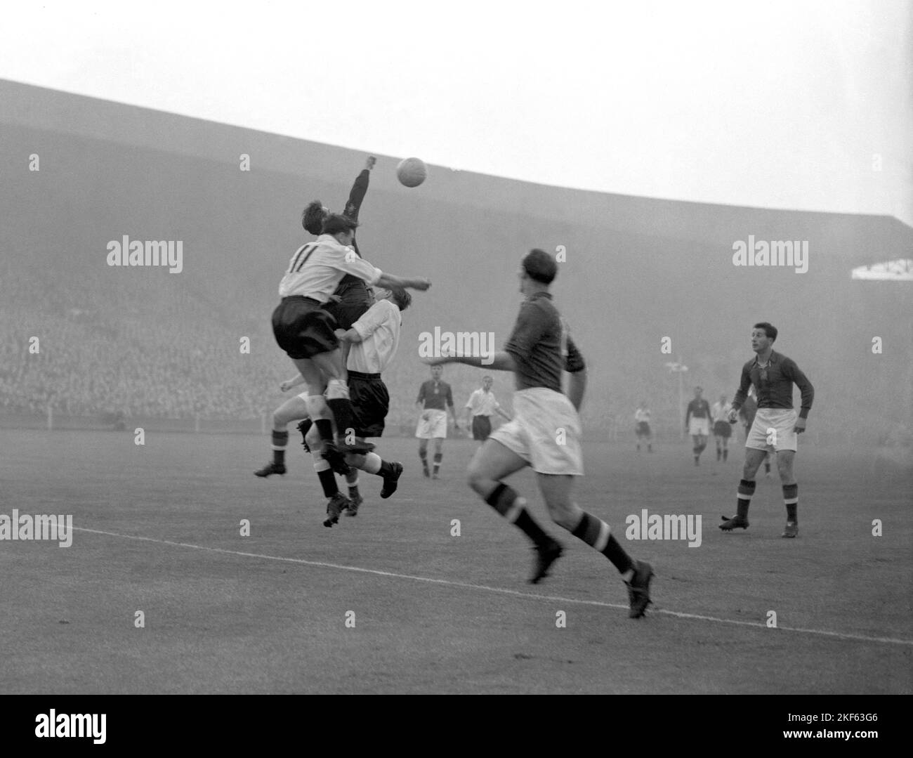 Gyula Grosics, the Hungarian goalkeeper, clears from England's George ...
