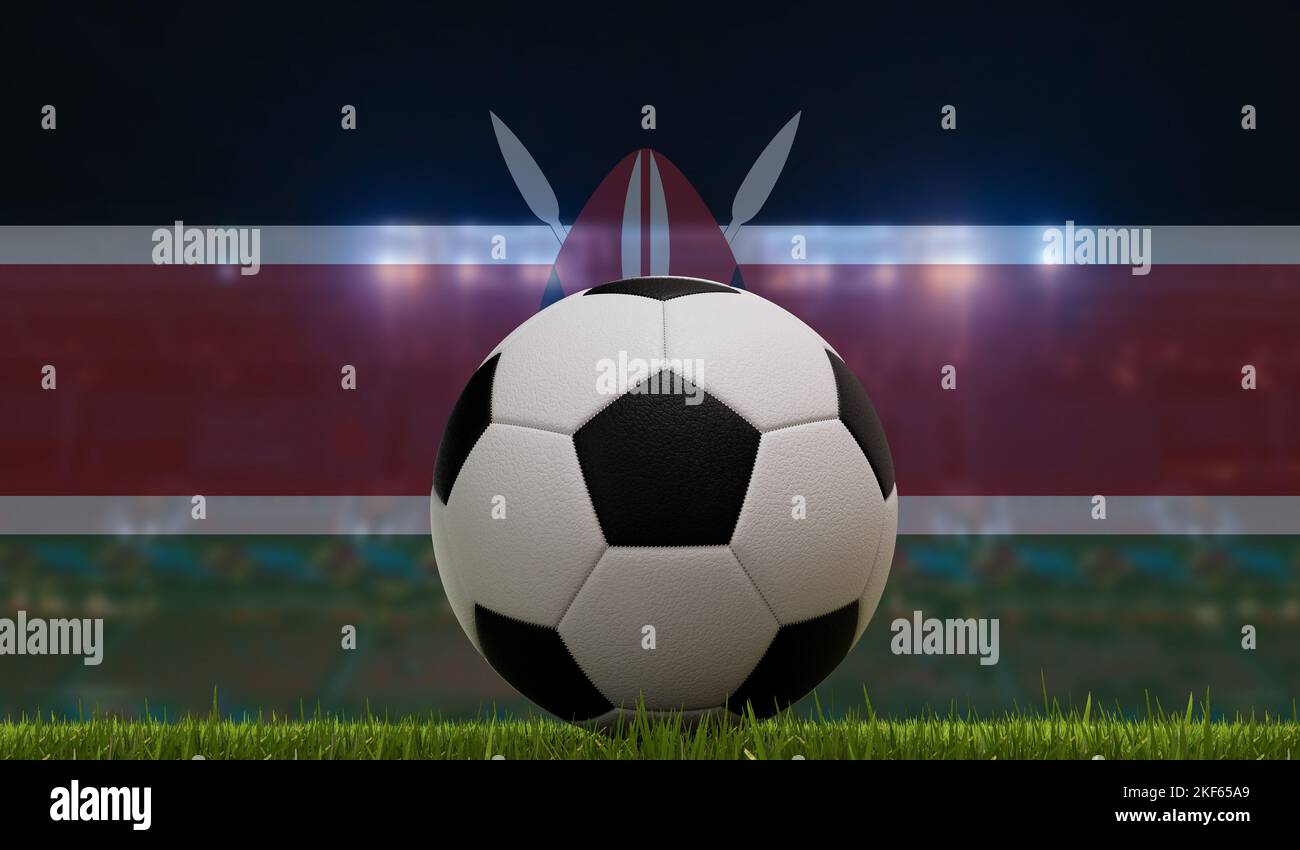 Soccer football ball on a grass pitch in front of stadium lights and