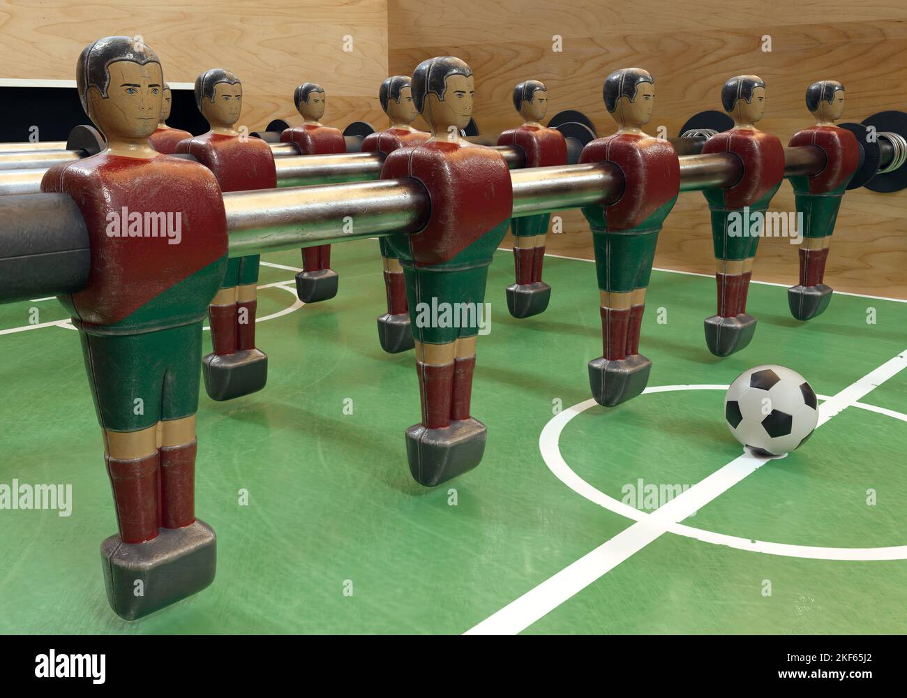 One side of a vintage foosball or table football table with worn metal