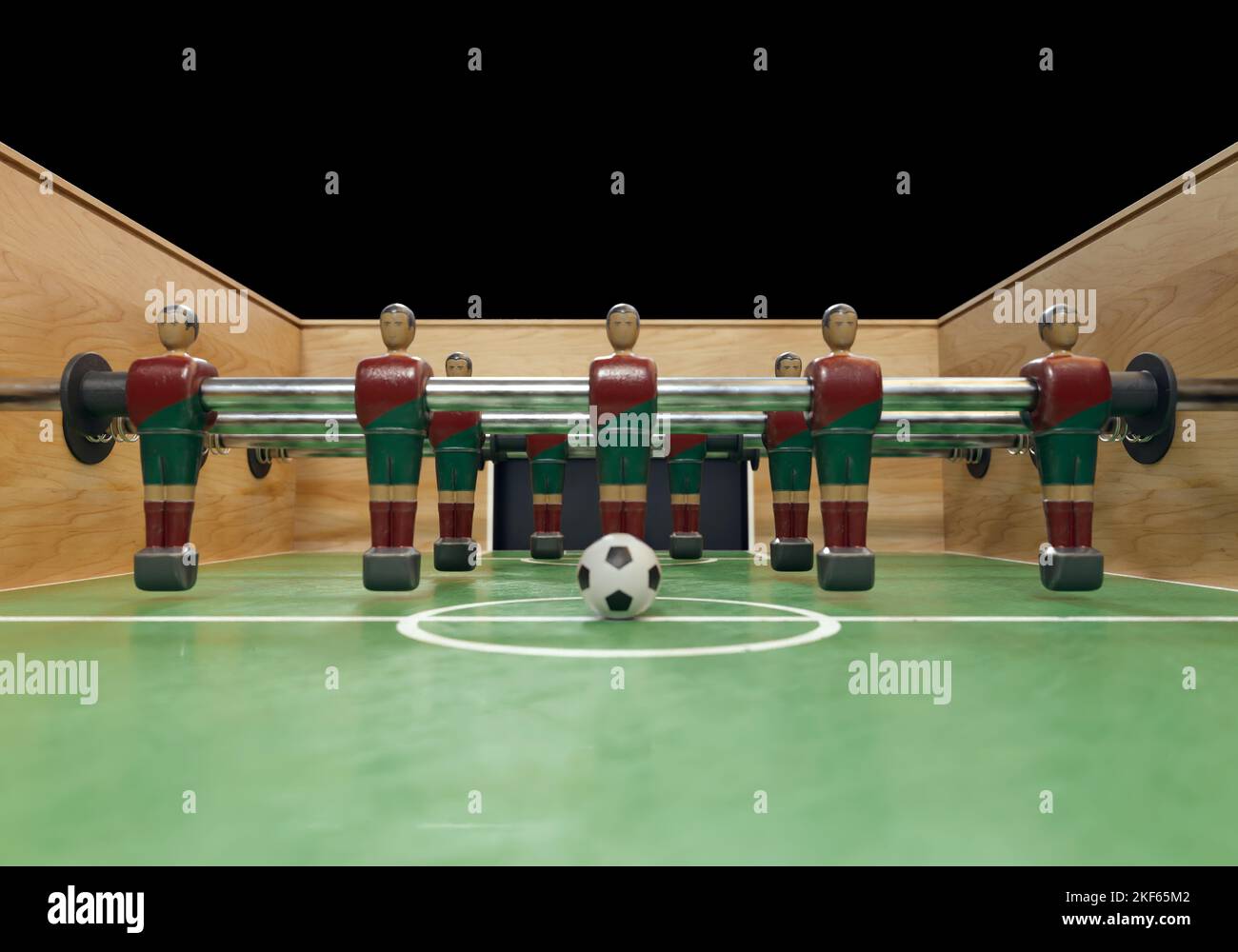 One side of a vintage foosball or table football table with worn metal