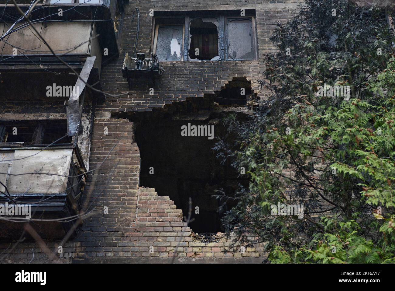 Close-up of a destroyed residential building after a massive Russian attack on Kyiv. In total, Russia launched about 100 cruise missiles on the territory of Ukraine and as a result infrastructure objects were damaged in many cities of the country. Stock Photo