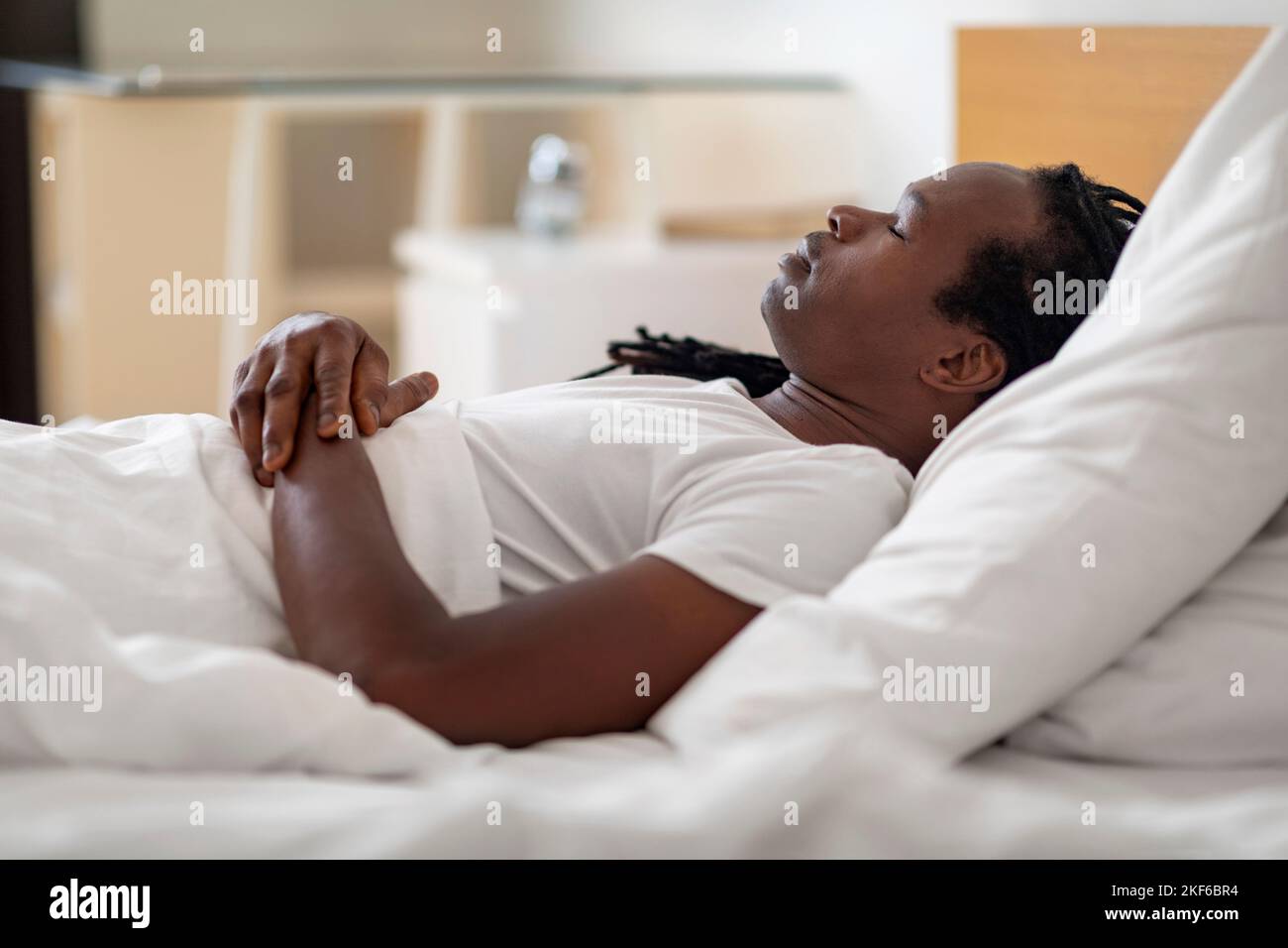 Side View Of Young Black Male Sleeping In Bed At Home Stock Photo Alamy