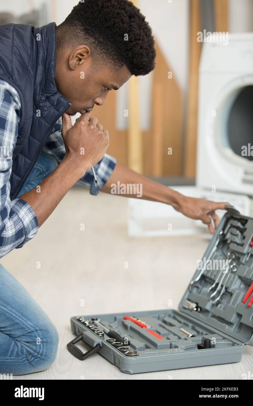 Men Fixing Tools repairman choosing correct tool from his toolkit Stock Photo - Alamy