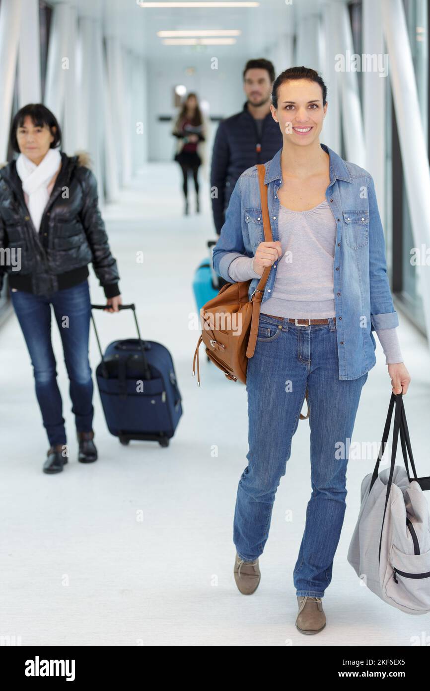 Asian woman walking in terminal hi-res stock photography and images - Alamy