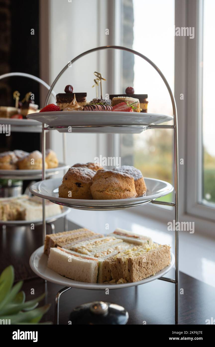 British afternoon tea cakes scones on English plate setting Stock Photo Alamy