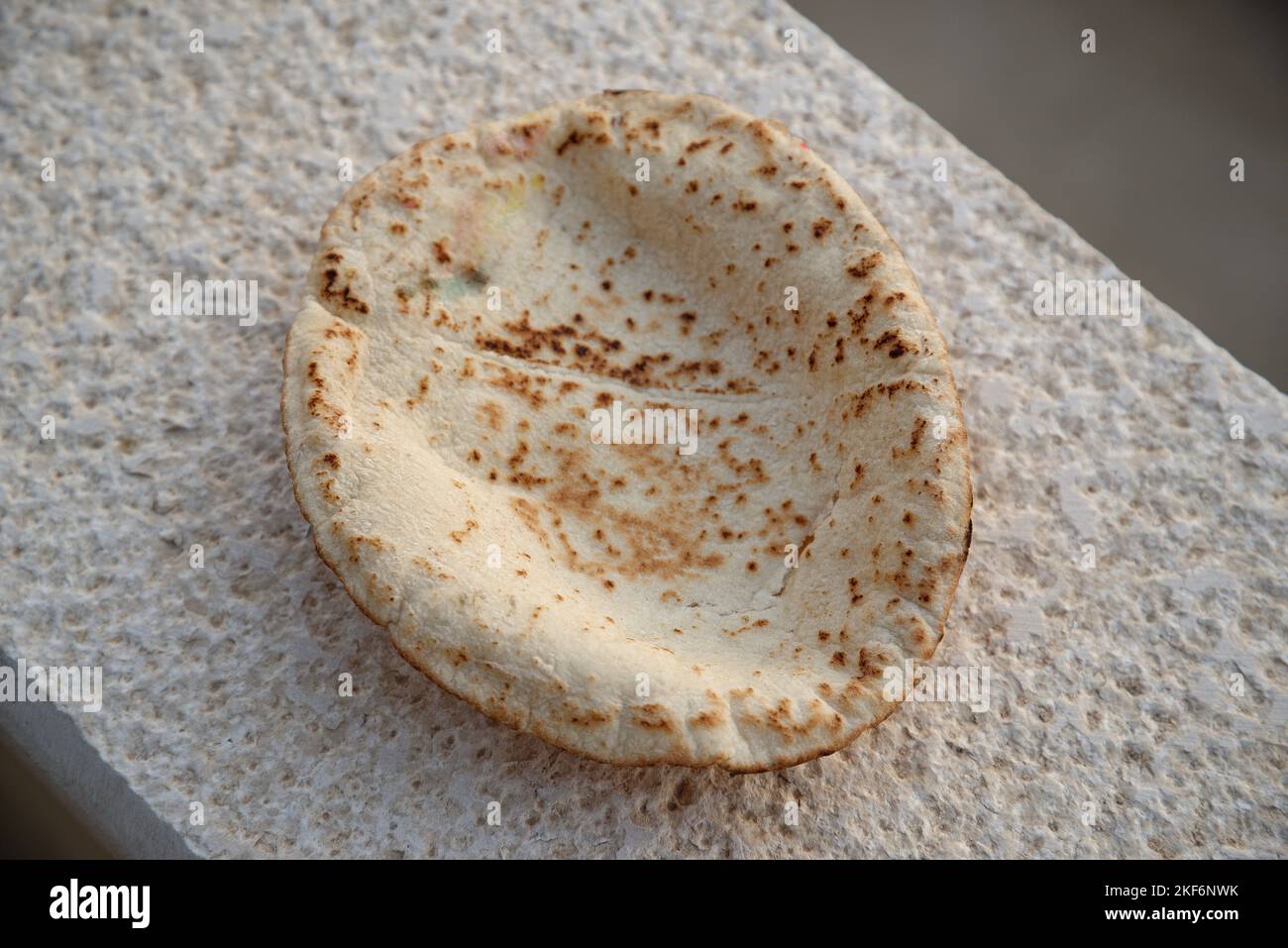 Jordanian flat bread and seeded bread sticks. Middle Eastern staple diet of wheat based food. Stock Photo